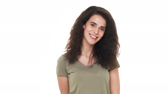 Closeup Portrait of Charming Lady Having Curly Hairstyle Looking on Camera Flirty and Smiling