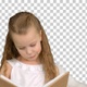 Pretty little girl sitting with book and reading, Alpha Channel - VideoHive Item for Sale