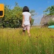 Child Walking On Grass Field - VideoHive Item for Sale