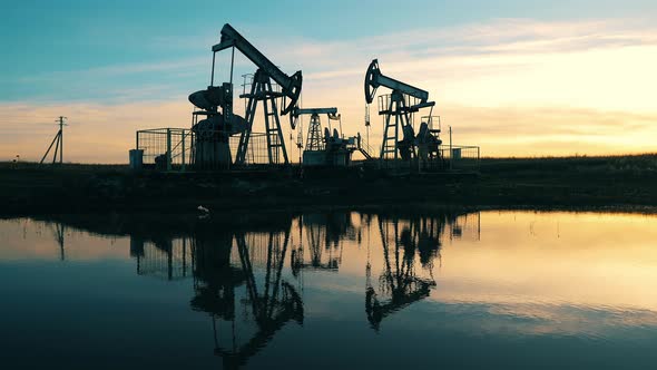 Oil Derricks Pumping Crude Oil at Oil Field