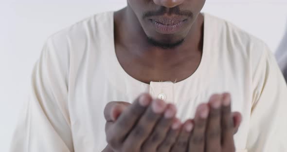 African Muslim Couple at Home in Ramadan Making Traditional Fatiha Prayer To Allah God While Wearing