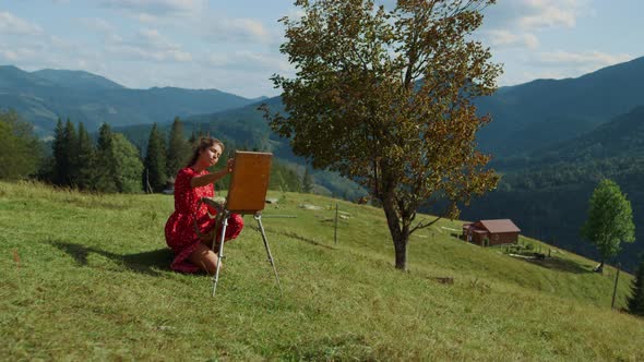 Inspired Girl Creating Picture on Green Hill