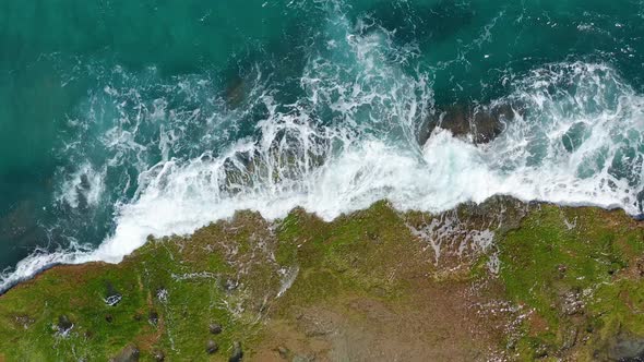 Aerial View. Waves Crashing on Rocks