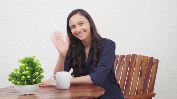 Indian girl saying Hello