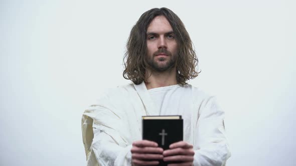 Jesus Giving Holy Bible, Calling for Prayer, Righteous Living in Catholicism