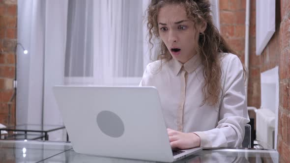 Shocked Young Female Upset By Surprise on Laptop