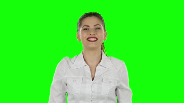 Young Business Woman Presenting Something By a Hand. Green Screen