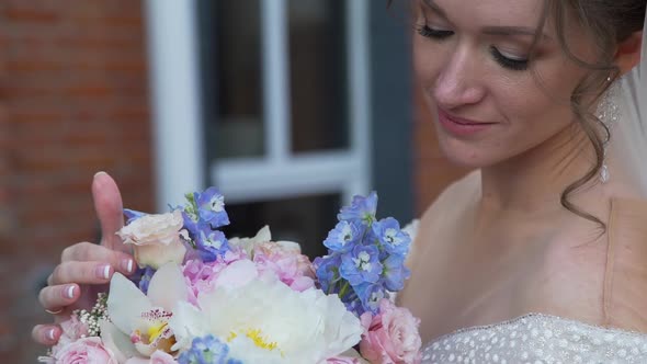 Beautiful Bride Touching Her Wedding Bouquet