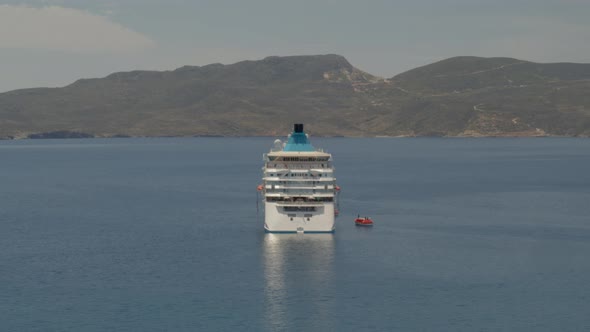 Aerial Pan Around a Cruise Ship Sailing in the Aegean Sea Near Milos Greece