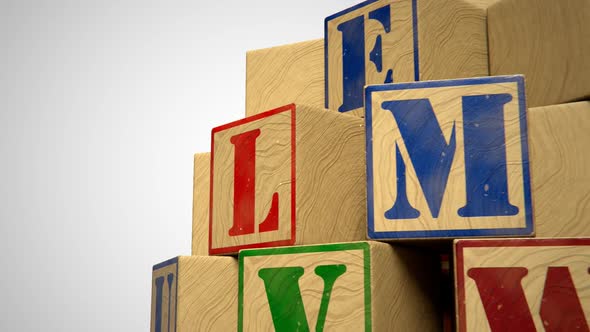 Blocks with colorful letters. Toys used to teach children spelling and writing.