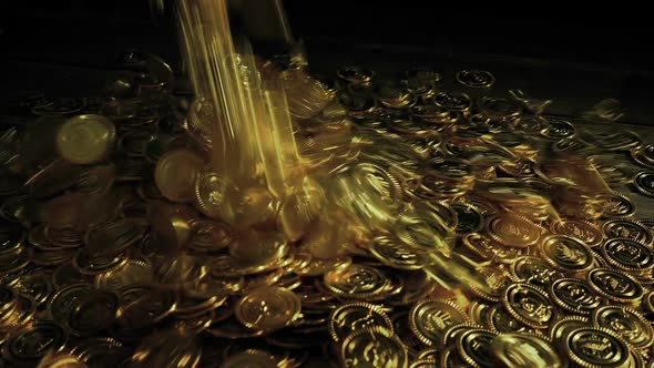 Big Pile Of Gold Coins Poured Onto Table