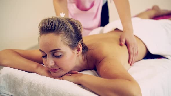 Woman Gets Back Massage Spa By Massage Therapist