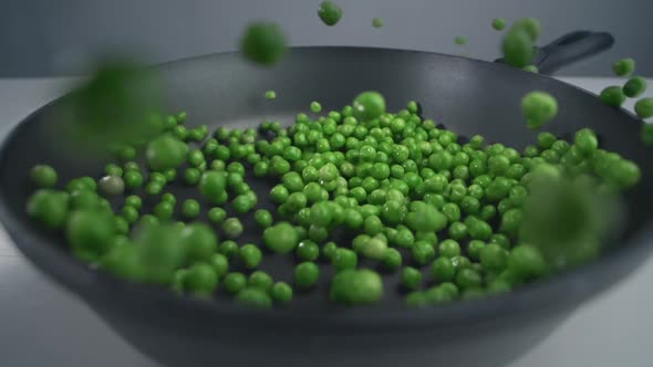 Green Peas Are Throwed To the Pan in Slow Motion, Fresh Vegetables Are Falling in 240 Fps, Cooking