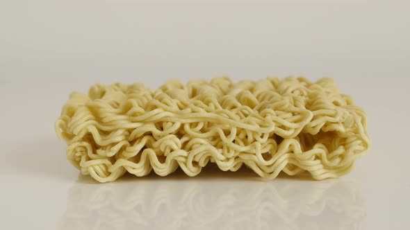 Close-up of Chinese type  noodles 4K 2160p 30fps UltraHD tilting footage - Instant staple food block