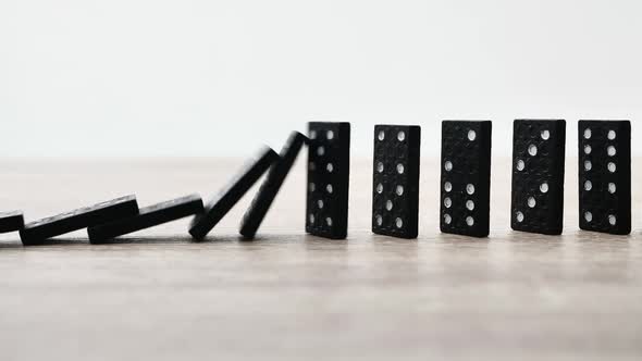 Domino Effect in Slow Motion  Falling Black Tiles with White Dots