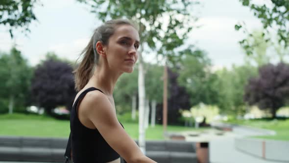 Video of woman walking in training outfit. Shot with RED helium camera in 8K. 