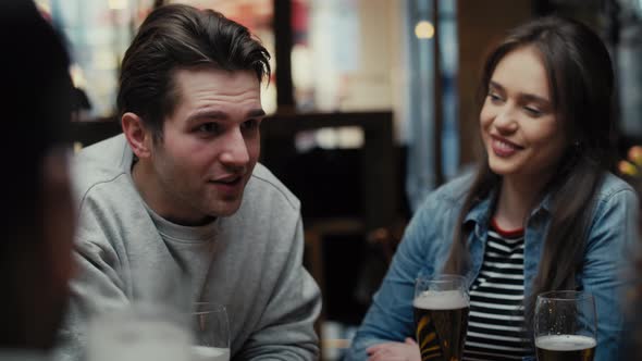 Mid shot video of group of friends spending time in the pub. Shot with RED helium camera in 8K.