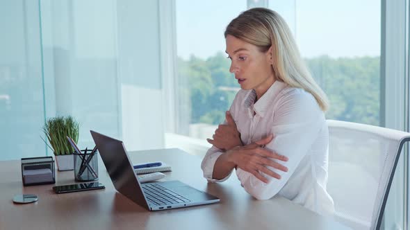 Office Worker Sitting on Workplace Suffering From Low Indoors Temperature