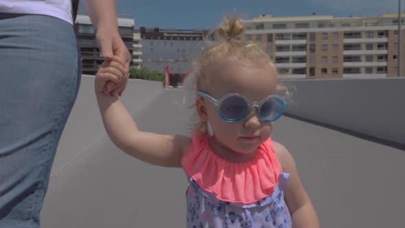 Fashionable little girl in sunglasses