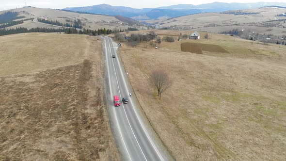 Cars Moving on the Road in the Mountains