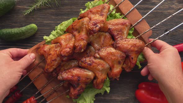 Top View of Delicious Fried Chicken Wings on the Skewers Placed on the Table