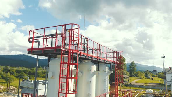 Aerial View Gas Production Station. Metal Construction with Valves on the Pipes. Distribution and