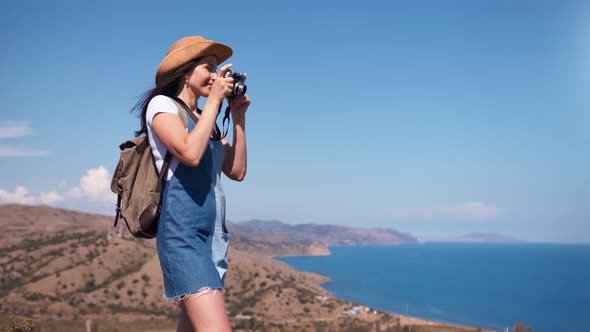 Active Tourist Happy Woman Taking Picture of Amazing Nature Seascape Using Camera