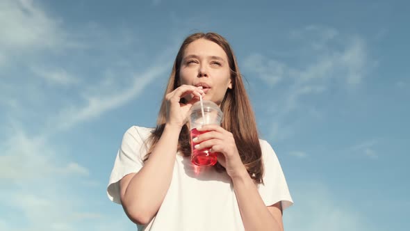 Young Caucasian Woman Drinking Soda