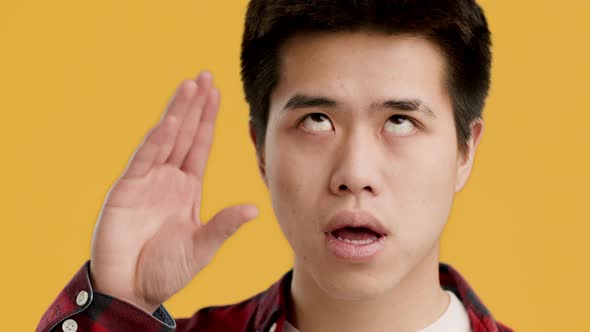 Bored Japanese Guy Gesturing Blah Blah Gesture Yellow Background