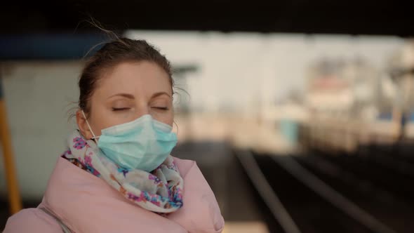 Woman In Mask Protection Epidemic Coronavirus On Public Transport Station. Girl Waiting Tram. COVID