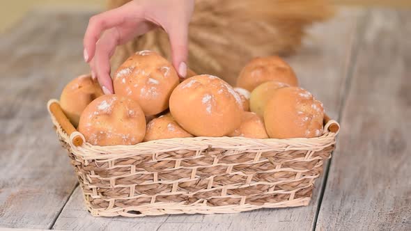 Fresh Bread Rolls in Basket at Traditional French Bakery.