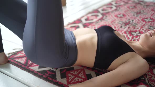 Fitness sport woman in fashion sportswear doing sport exercise in livingroom at her home