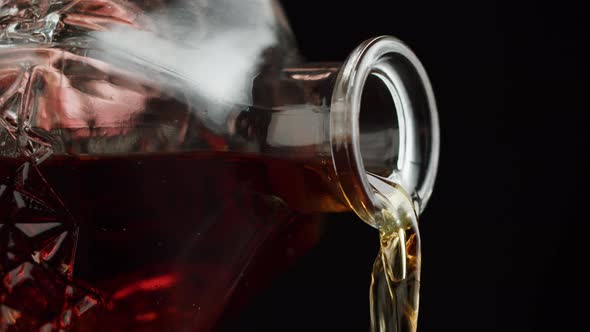 Pouring Brandy or Whiskey Closeup