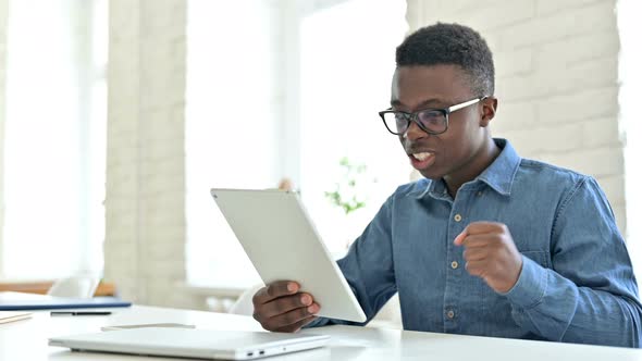 Success, Young African Man Celebrating on Tablet