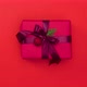 Female hands put christmas present on the red background - Stop motion animation - VideoHive Item for Sale