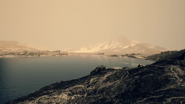 Coastline of Antarctica with Stones and Ice