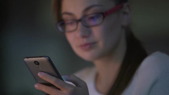 Young Woman Browsing Pages on Smartphone, Using Mobile App, Shopping Online