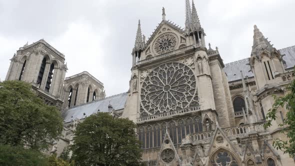 Architecture  of Notre-Dame Cathedral located in France capital Paris slow tilt 4K 2160p UltraHD foo