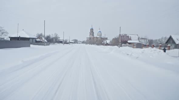 Driving Through Old Russian Village in Winter