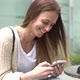 Woman texting on a smart phone - VideoHive Item for Sale