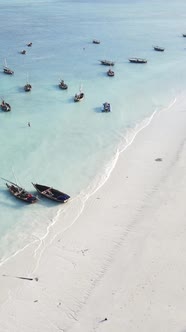 Vertical Video Boats in the Ocean Near the Coast of Zanzibar Tanzania