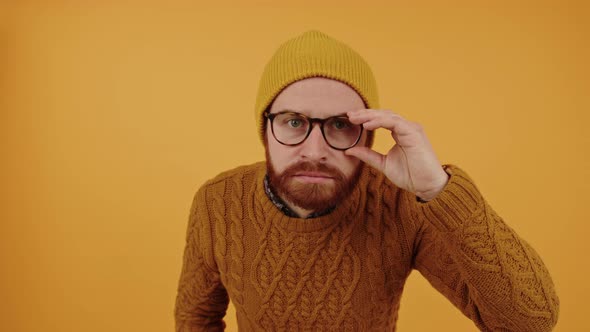 Young Bearded Millennial in Doubts Closeup Isolated Yellow Background