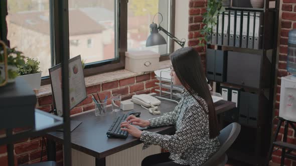 Portrait of Asian Business Woman Working on Computer