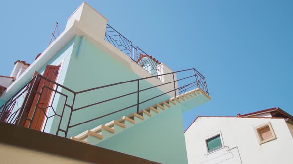 Stairs Leading to Roof of Bright Blue House in Burano