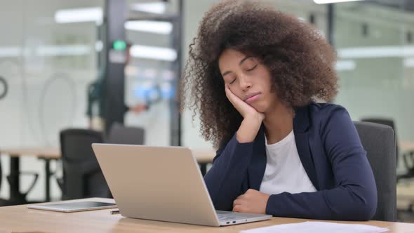 Sleepy Young African Businesswoman with Laptop Having Nap 