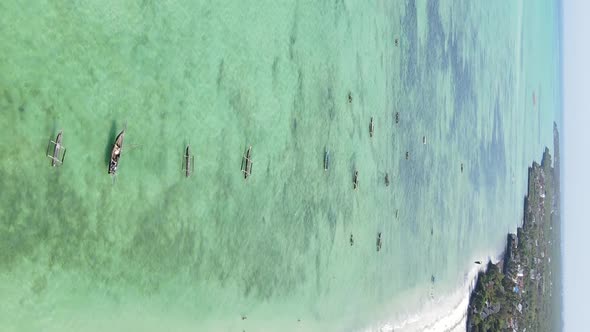 Vertical Video Boats in the Ocean Near the Coast of Zanzibar Tanzania Aerial View