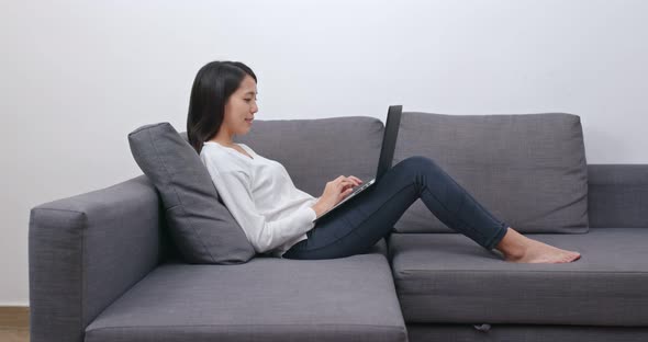 Woman Work on Computer and Lying on Sofa