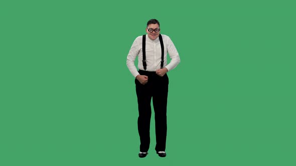 Portrait of a Shy Man Dancing on a Green Screen