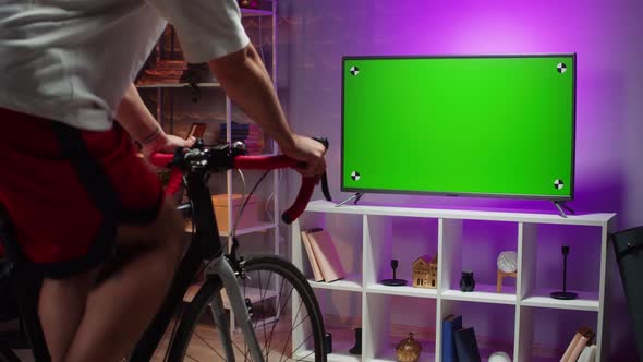 Sportsman Riding Bicycle and Watching Tv Home Gym