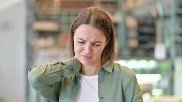 Portrait of Stressed Woman Having Neck Pain 